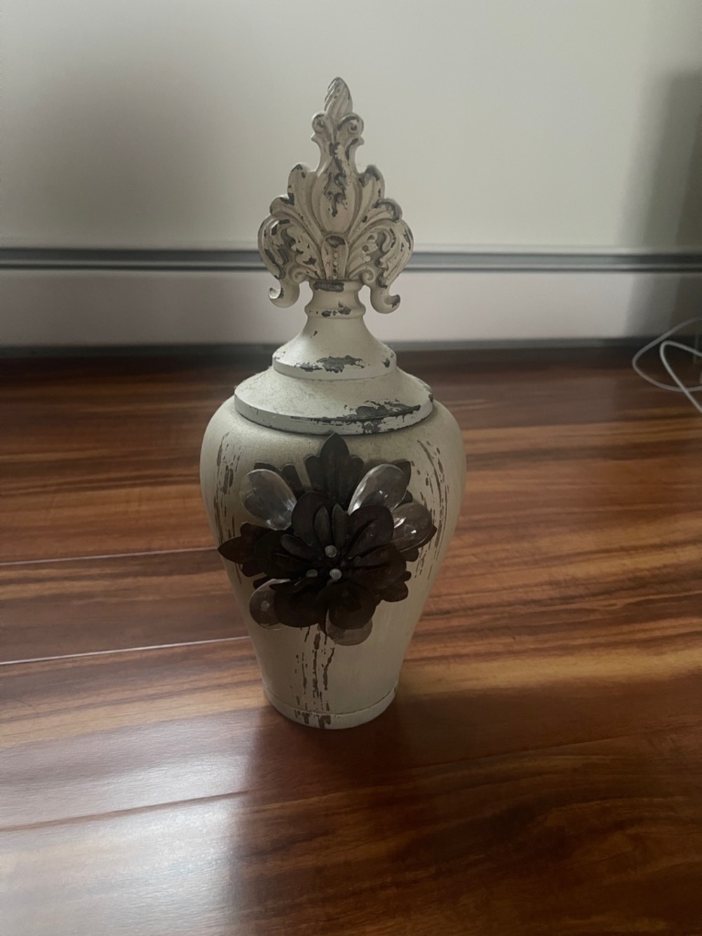 Source Unknown Cream Distressed Urn with Dark Metal Flower Accent